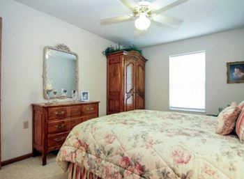 Bedroom with plush carpeting